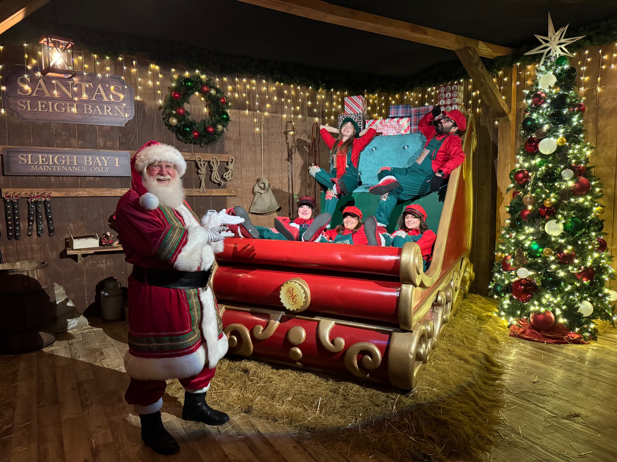 Santa Jangle at Santa's Sleigh Barn with elves
